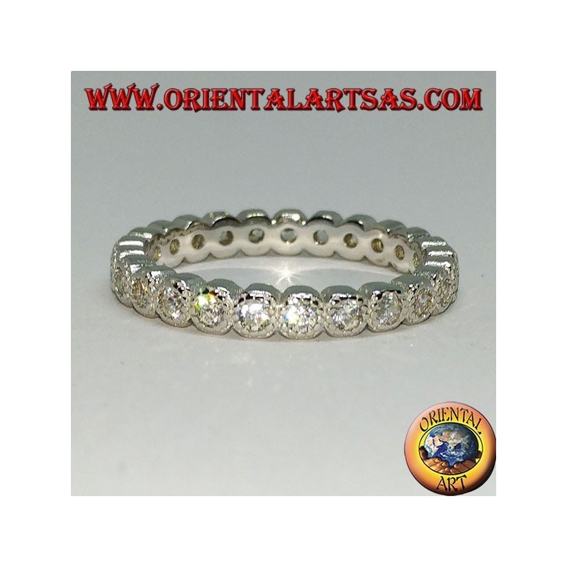 Anello in argento a fedina con zirconi incastonati singolarmente